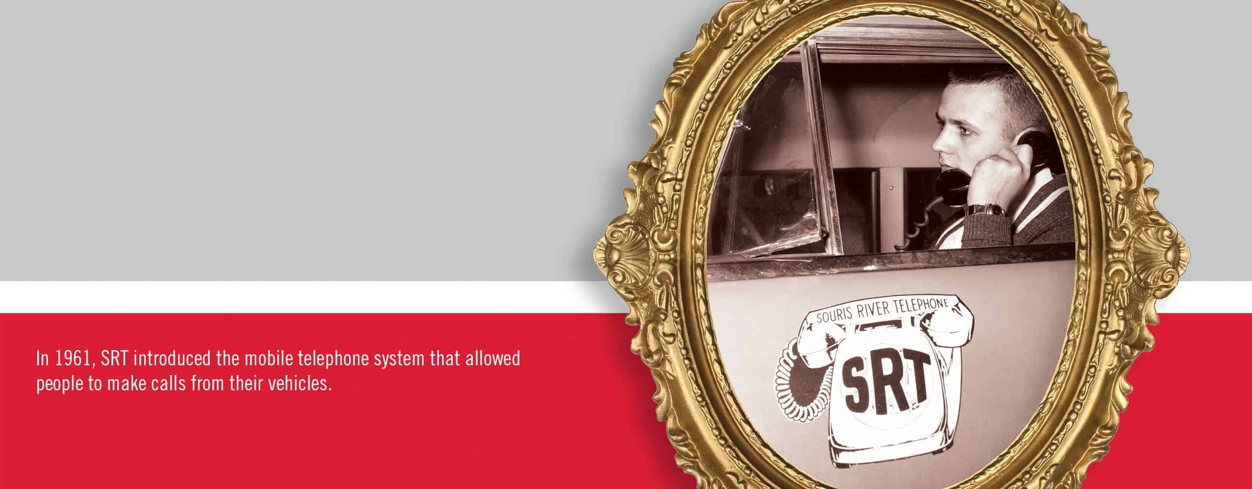 SRT employees demonstrate a telecommunications power panel used in the 1960s.